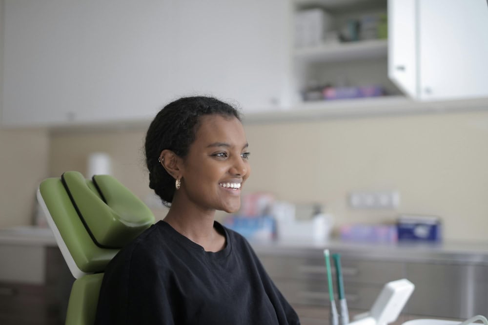 Smiling patient in Dental Office chair | Technology modern dental office